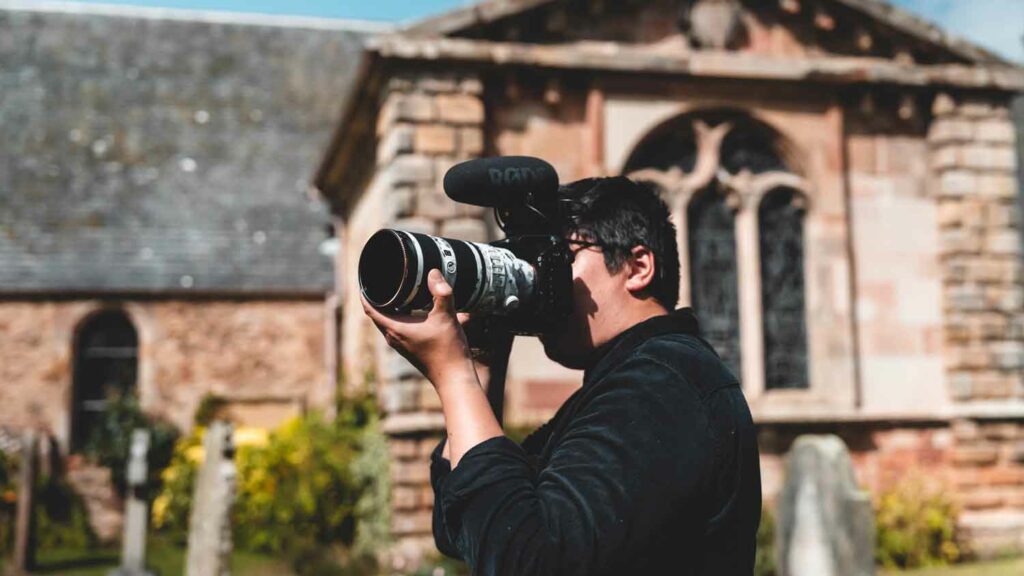 5 reasons why a second videographer is a good investment? Sean Campbell filming at a church with the Sony 70-200 f2.8 lens as my second videographer