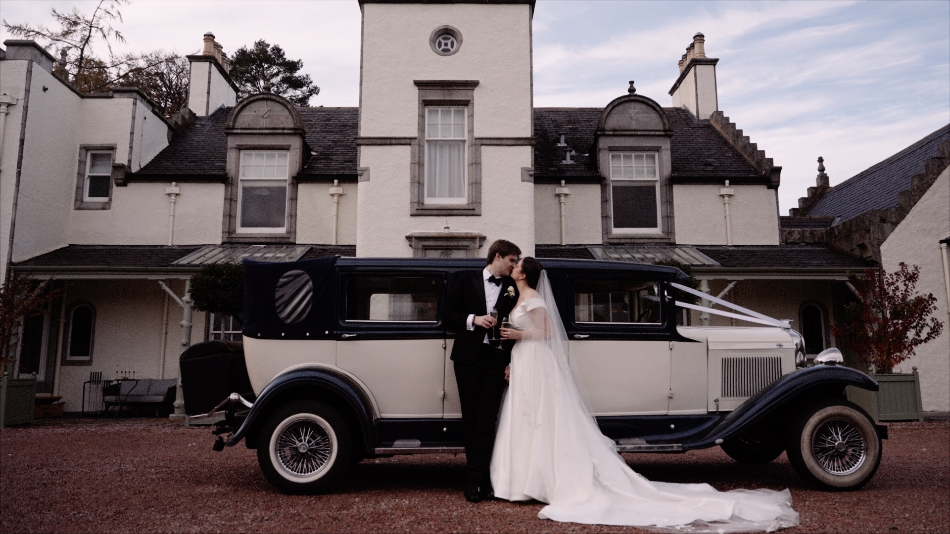 casey and tom wedding standing in front of wedding car at Douneside House