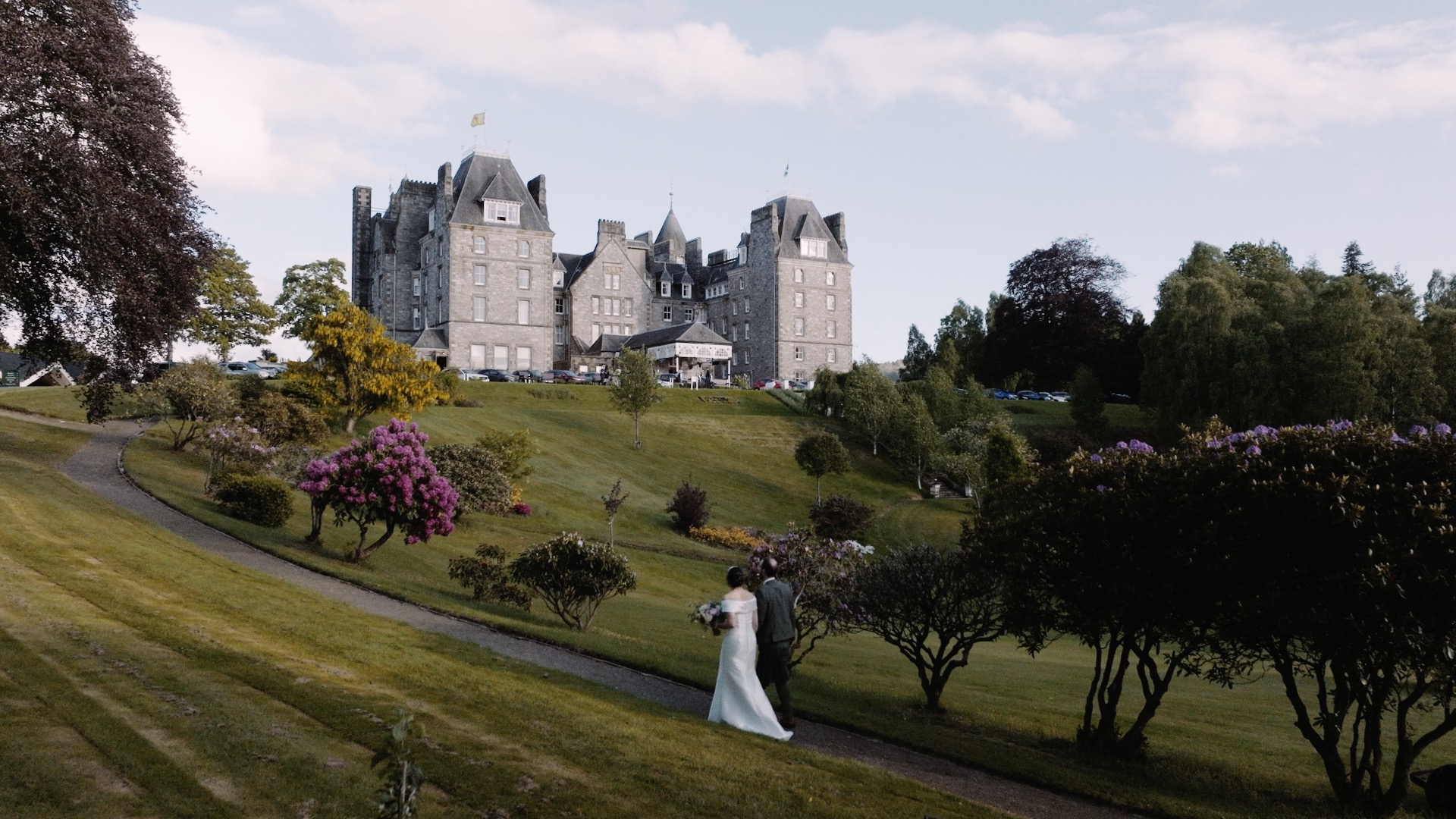 rebecca and andrew walking towards Atholl Palace